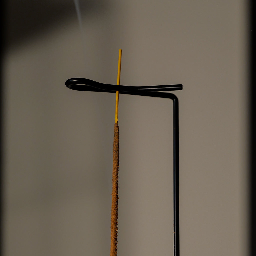 Incense stick on a stand with a blurred background