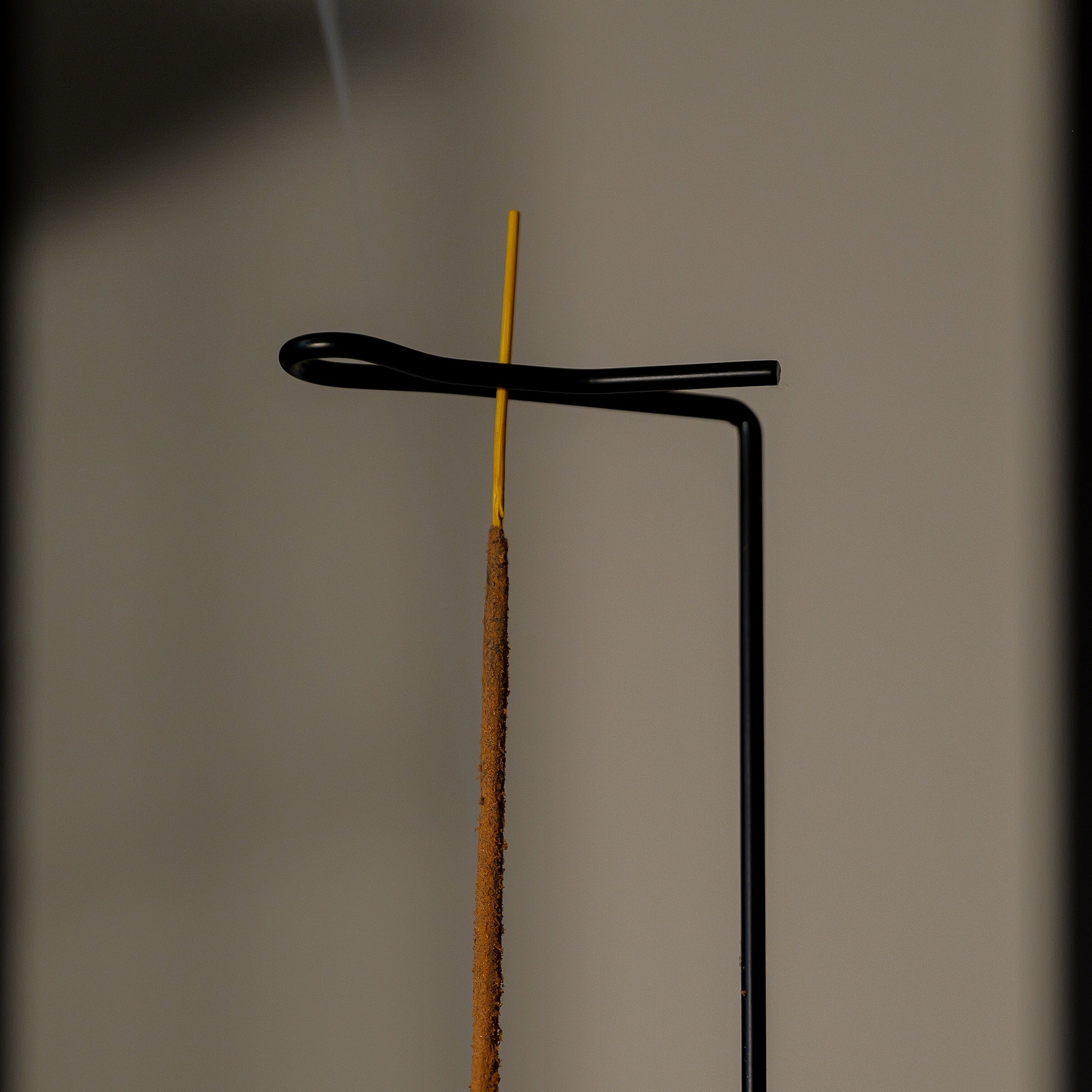 Incense stick on a stand with a blurred background